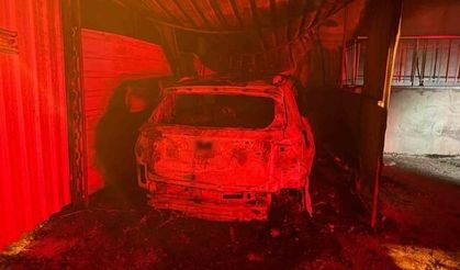 Antalya'da garaj yangını otomobili ve binayı zarar verdi